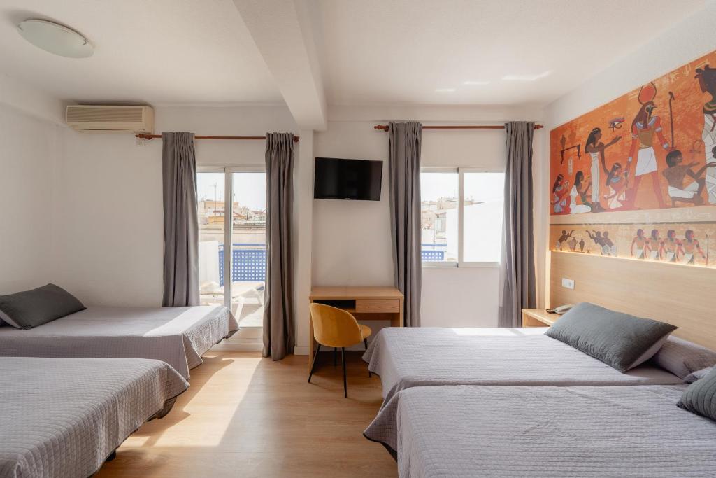 Postel nebo postele na pokoji v ubytování Hotel Internacional