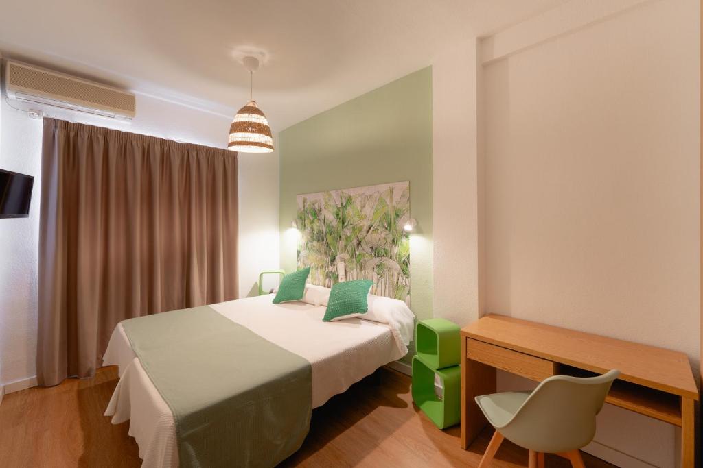 Postel nebo postele na pokoji v ubytování Hotel Internacional