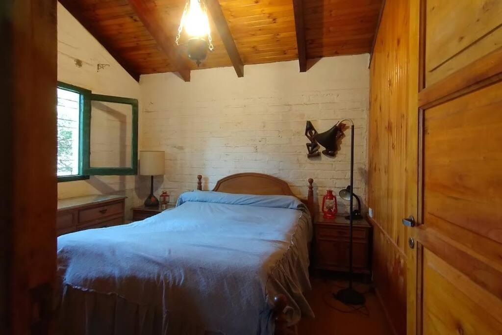 Ένα ή περισσότερα κρεβάτια σε δωμάτιο στο Cálida casa de montaña