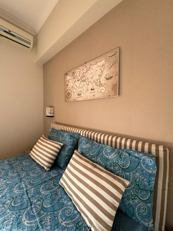 Postel nebo postele na pokoji v ubytování B&B Over the World