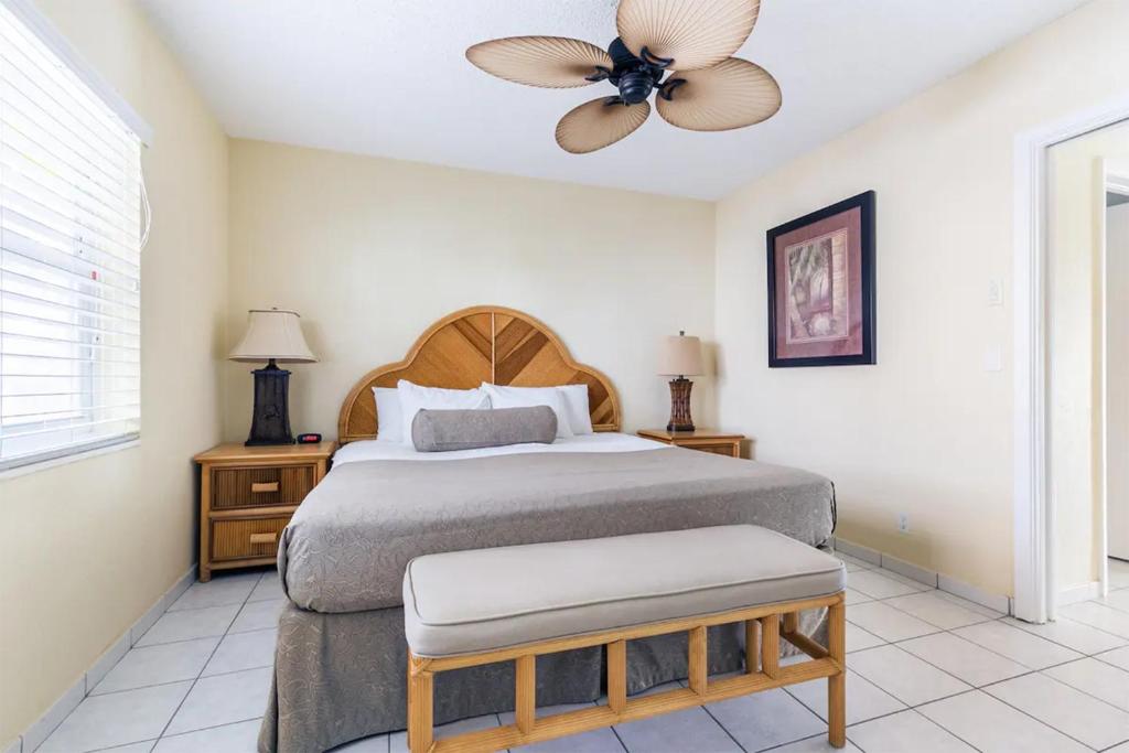 a bedroom with a bed and a ceiling fan at Berkshire on the Ocean in Delray Beach