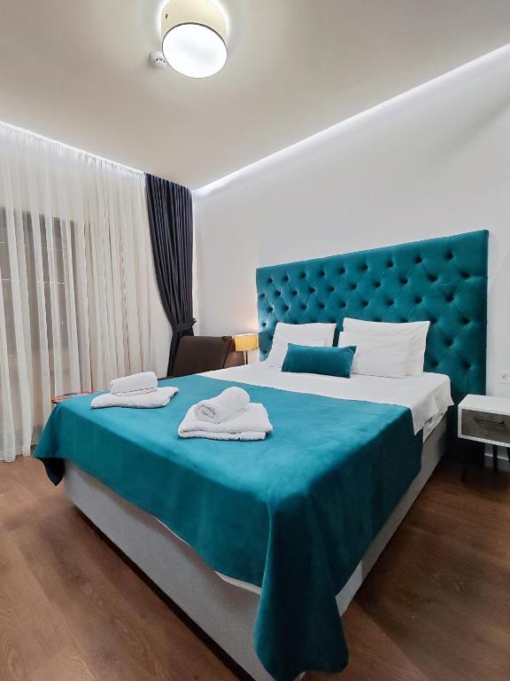 Postel nebo postele na pokoji v ubytování Lolo Luxury rooms & suites