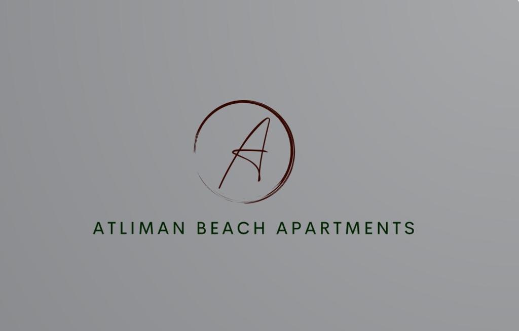 キテンにあるAtliman Beach Apartment 1のアトキン マン ビーチ アパートメント ロゴ