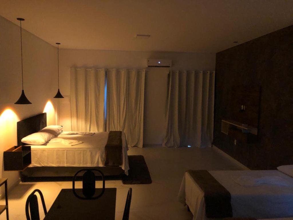 Ένα ή περισσότερα κρεβάτια σε δωμάτιο στο Lençóis Prime Apartments