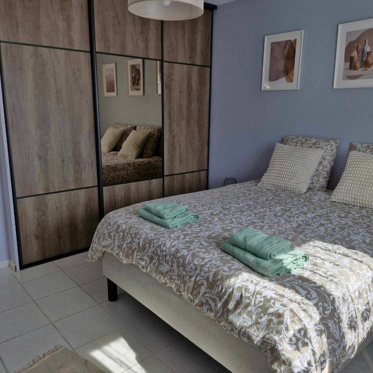 Llit o llits en una habitació de Maison de vacances