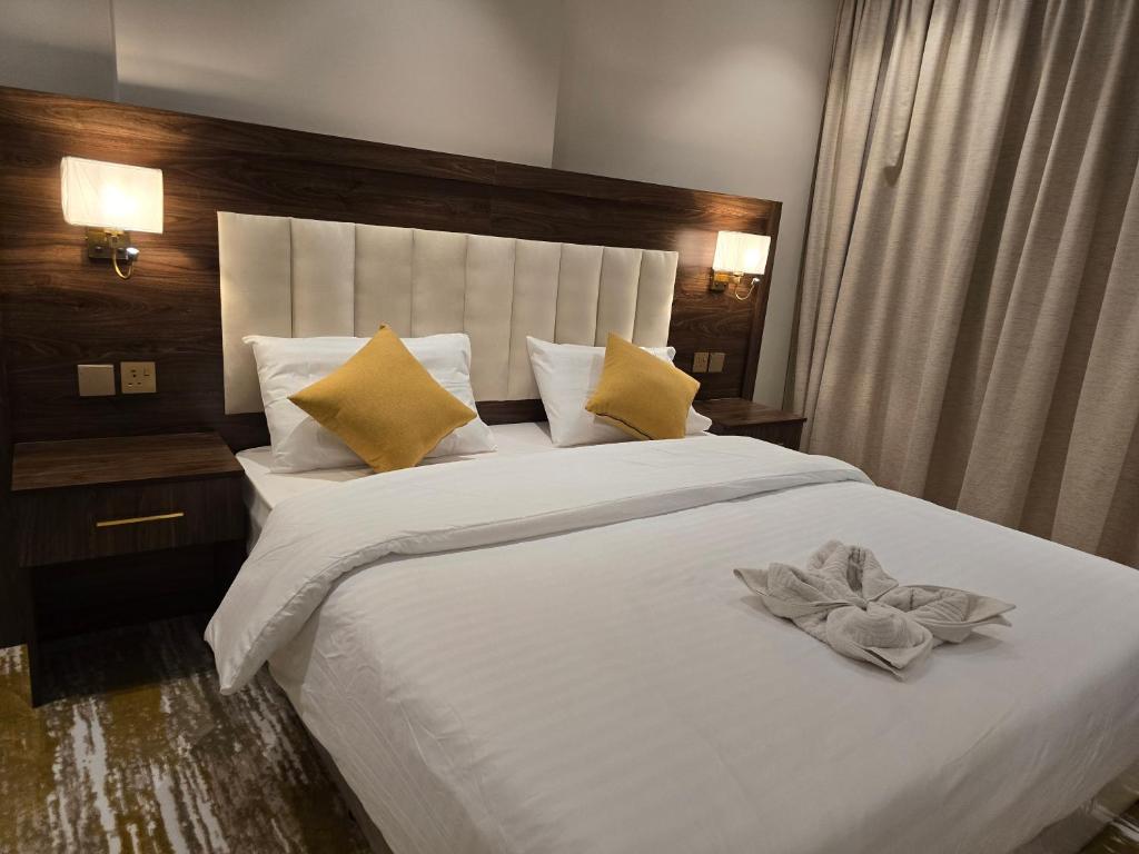 Postel nebo postele na pokoji v ubytování سحابة الأحلام - Dream Cloud Hotel