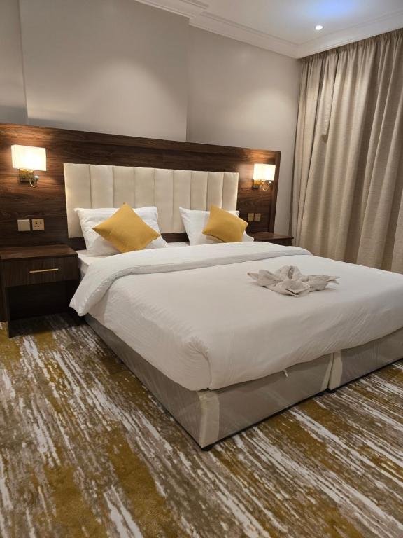 Postel nebo postele na pokoji v ubytování سحابة الأحلام - Dream Cloud Hotel
