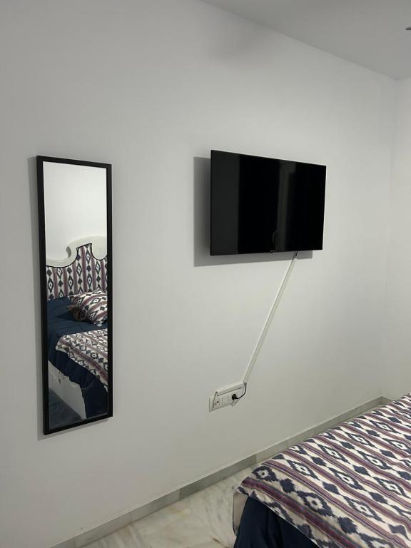 Telewizja i/lub zestaw kina domowego w obiekcie APARTAMENTO CASA AZUL