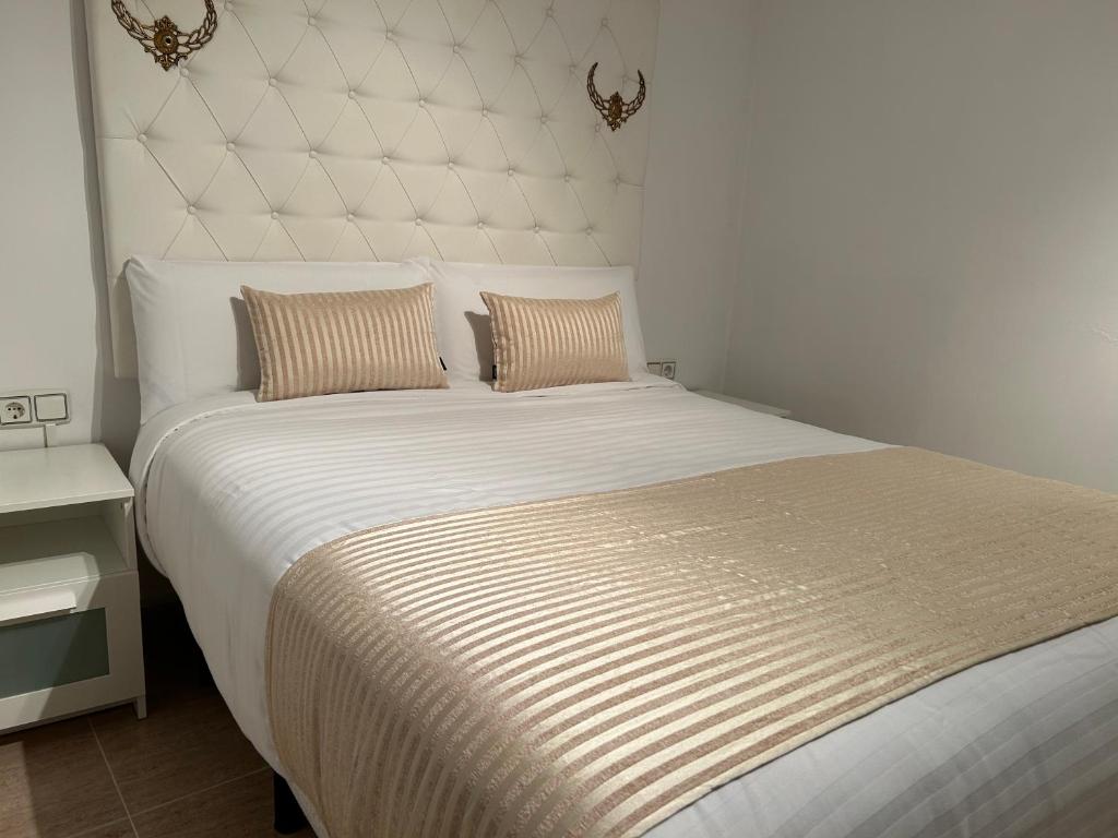 Ένα ή περισσότερα κρεβάτια σε δωμάτιο στο Piso Zentro Calatayud