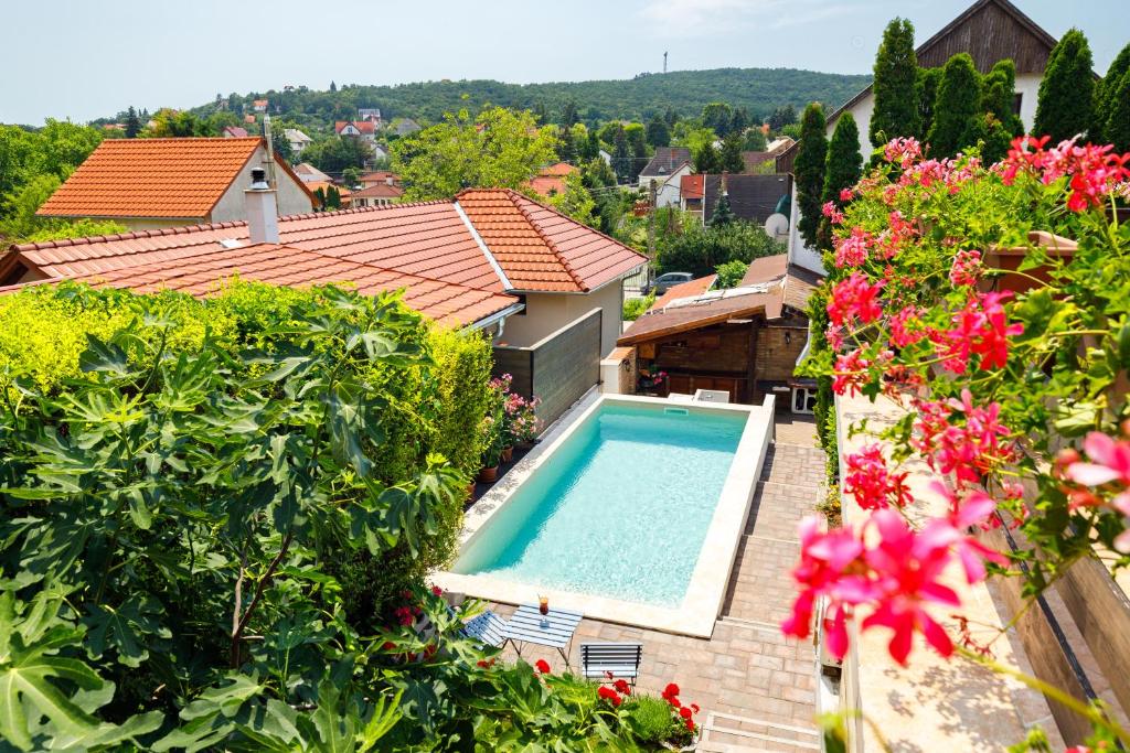 an aerial view of a house with a swimming pool and flowers at Casa Montana Apartments in Balatonalmádi