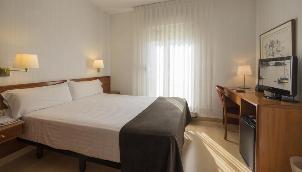 Postel nebo postele na pokoji v ubytování Hotel Ultonia