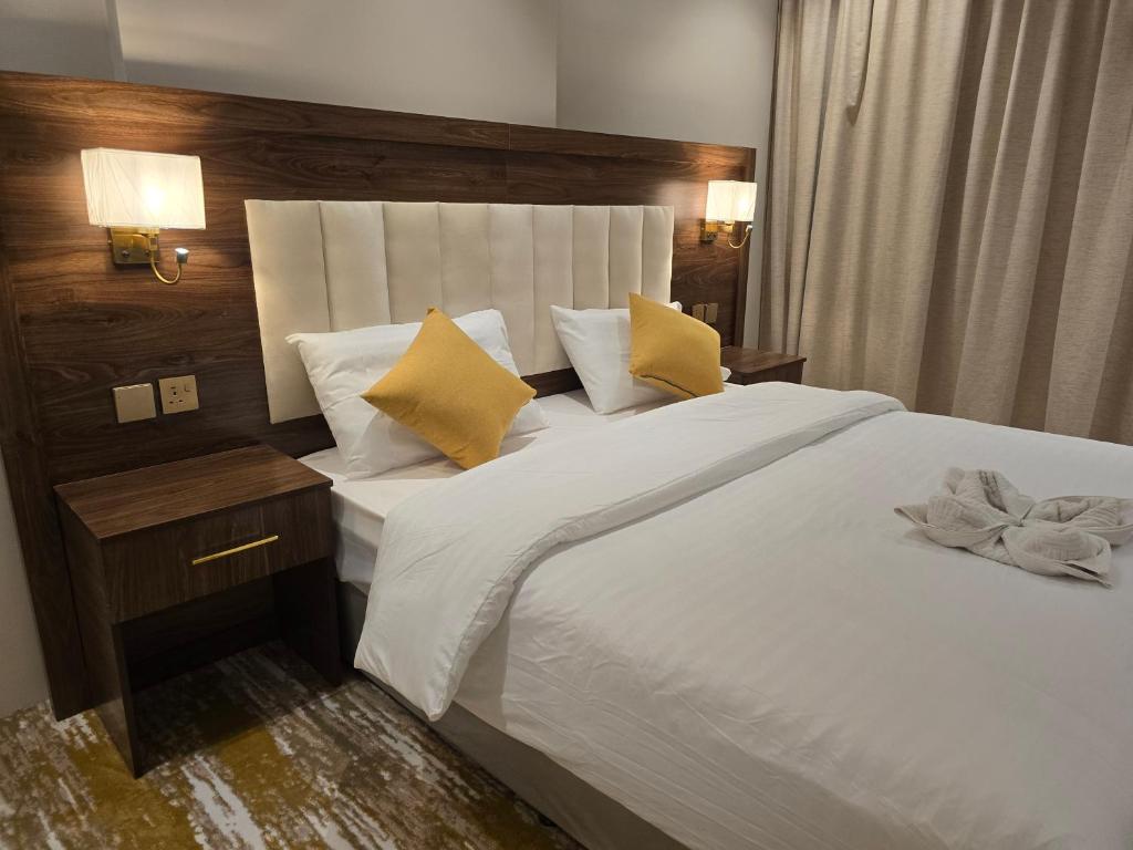 Postel nebo postele na pokoji v ubytování سحابة الأحلام - Dream Cloud Hotel