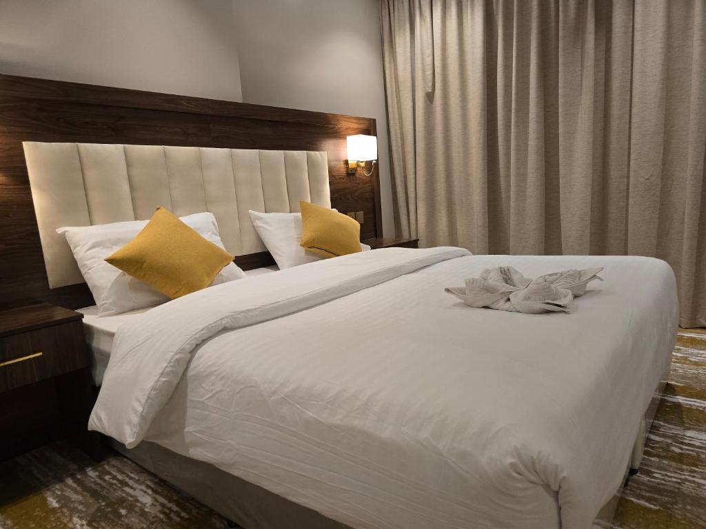 Postel nebo postele na pokoji v ubytování سحابة الأحلام - Dream Cloud Hotel
