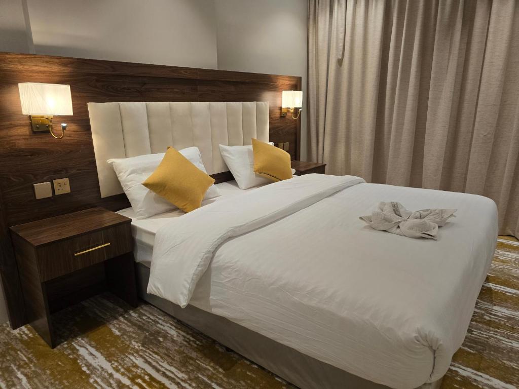 Postel nebo postele na pokoji v ubytování سحابة الأحلام - Dream Cloud Hotel