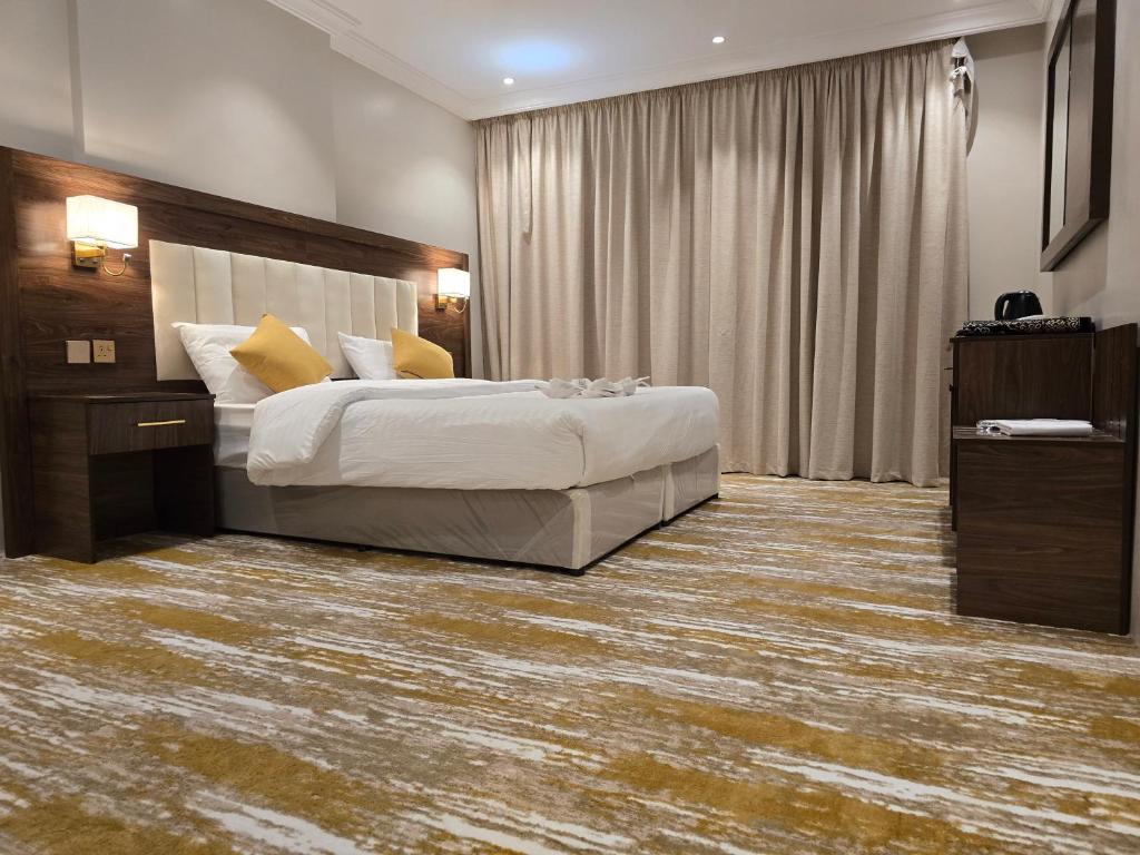 Postel nebo postele na pokoji v ubytování سحابة الأحلام - Dream Cloud Hotel