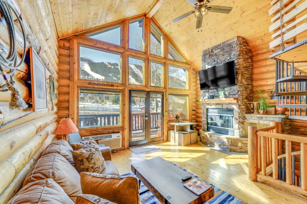 a living room with a couch and a fireplace at Cozy Mountain Condo Across From Snow King Ski Mtn! in Jackson