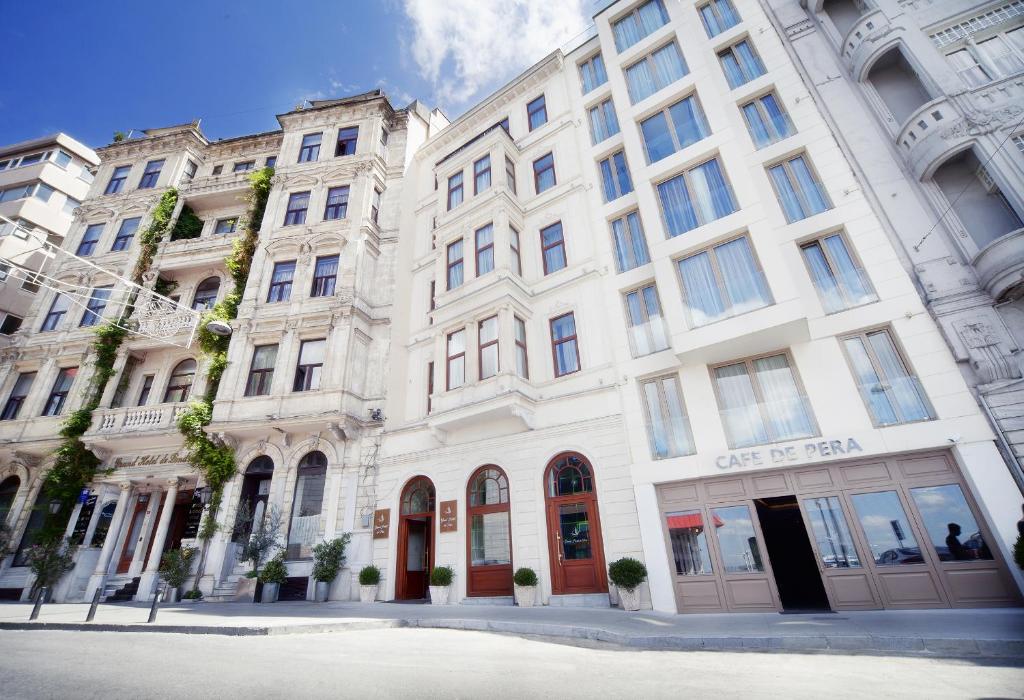 a large white building on the side of a street at Grand Hotel de Pera in Istanbul