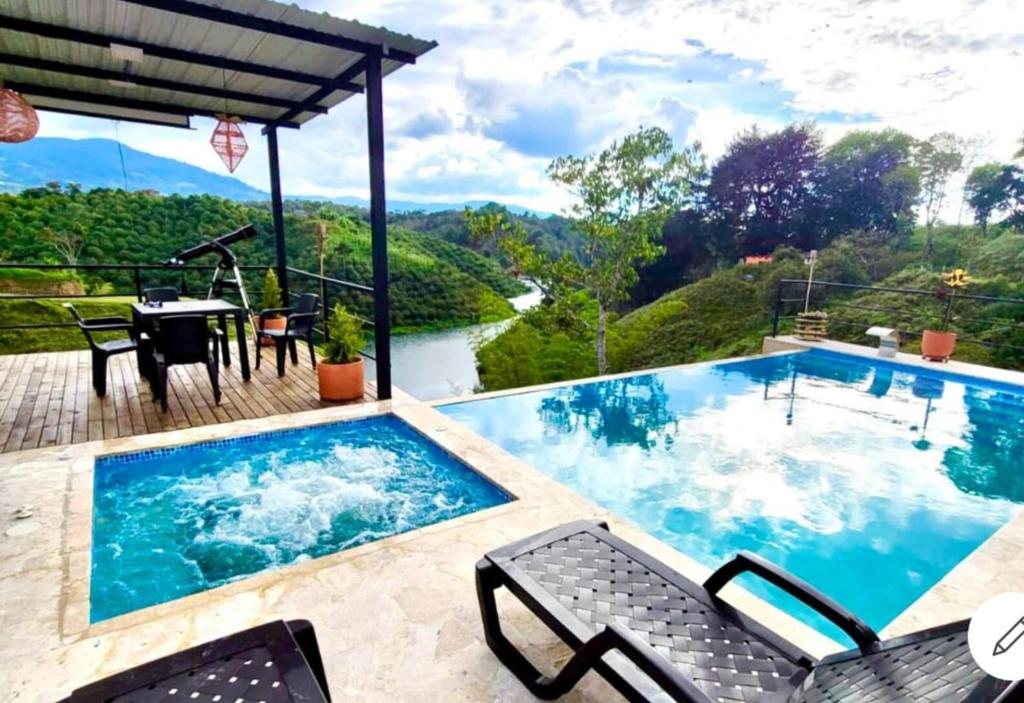a swimming pool with a view of a mountain at Hermosa habitación 202!! in Guatapé