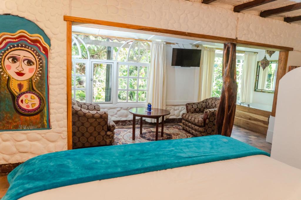 Postel nebo postele na pokoji v ubytování Spa Hosteria Miramelindo