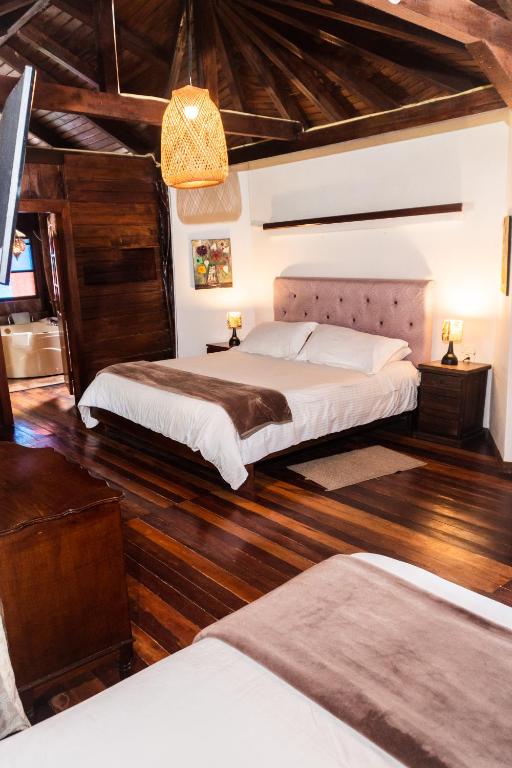Postel nebo postele na pokoji v ubytování Spa Hosteria Miramelindo
