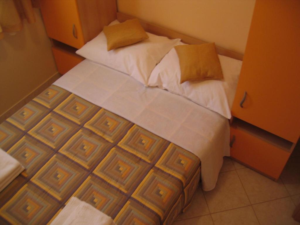 Postel nebo postele na pokoji v ubytování Apartments Seka
