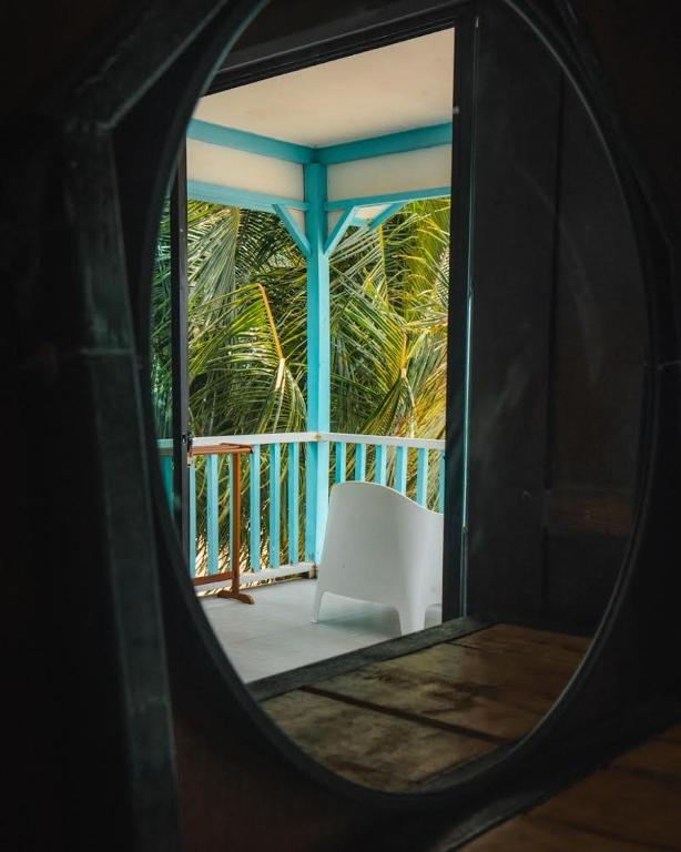a view of a white chair on a porch at Pondok Beach Shack in Tioman Island
