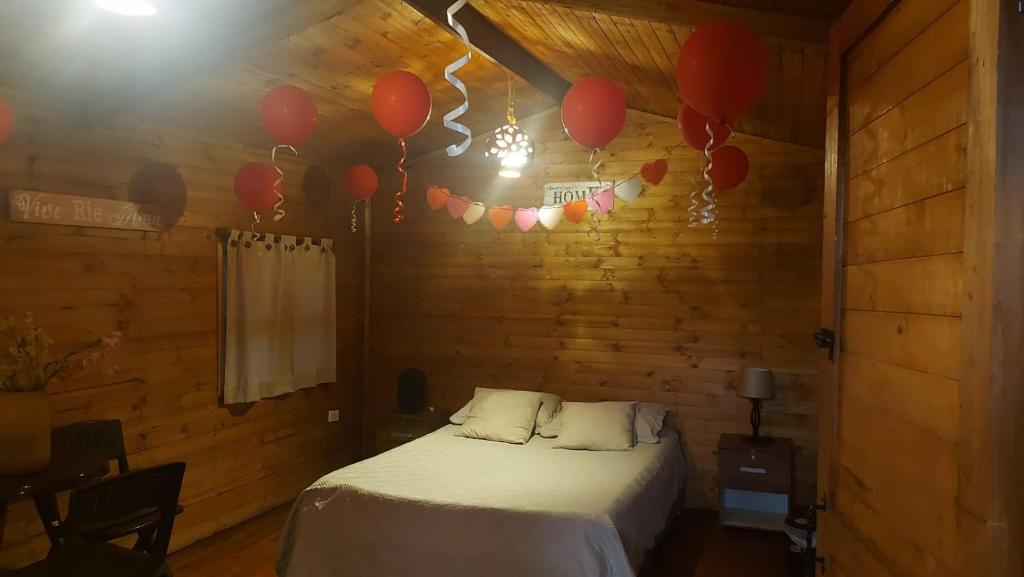 Postel nebo postele na pokoji v ubytování Mundo Nuevo Cabañas