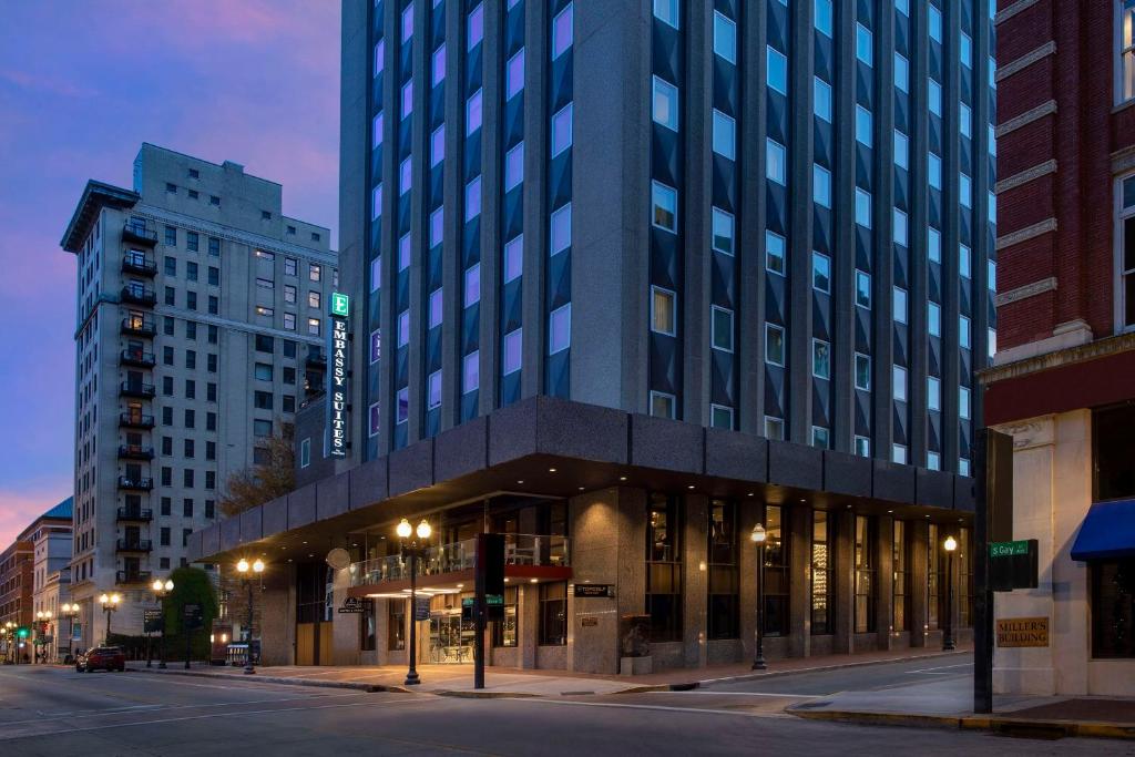 a large building on a city street at night at Embassy Suites By Hilton Knoxville Downtown in Knoxville