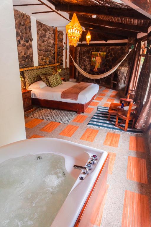 Postel nebo postele na pokoji v ubytování Spa Hosteria Miramelindo