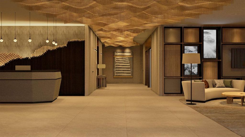 a lobby of a hotel with a wooden ceiling at Doubletree By Hilton Lagoa Azores in Lagoa