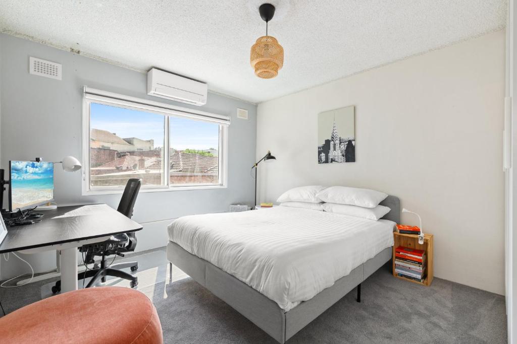 Ένα ή περισσότερα κρεβάτια σε δωμάτιο στο Cosy Sydenham 1-Bed by Inner-West's Attractions