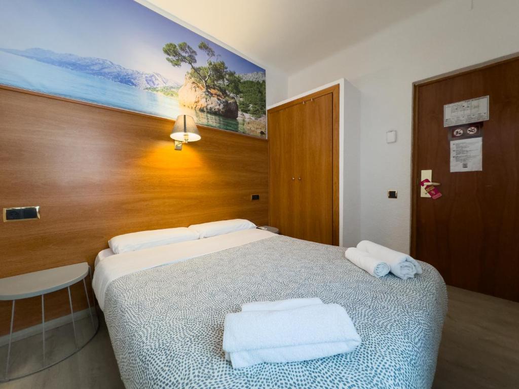 Postel nebo postele na pokoji v ubytování Hotel Maremagnum