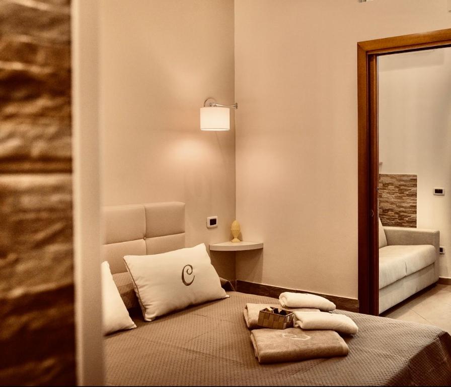 Ένα ή περισσότερα κρεβάτια σε δωμάτιο στο Il tempo di un Caffè