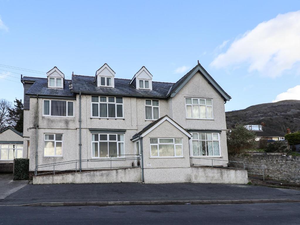 a large house with a lot of windows at Gwynant in Rhyl