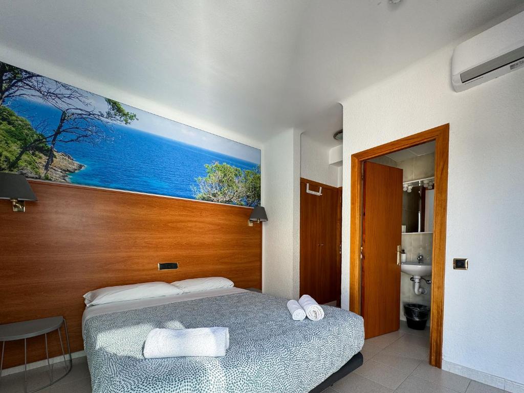 Postel nebo postele na pokoji v ubytování Hotel Maremagnum