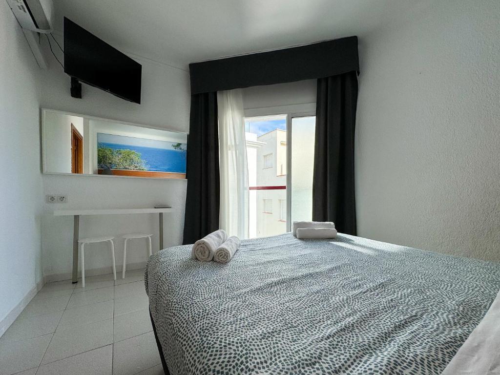 Postel nebo postele na pokoji v ubytování Hotel Maremagnum