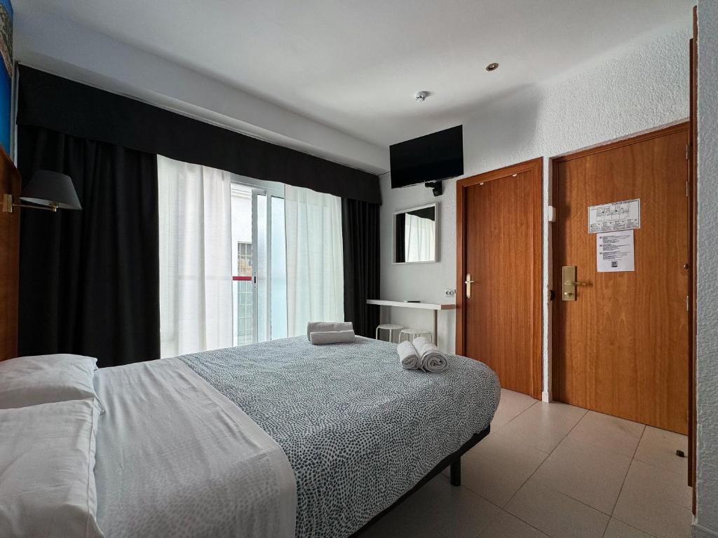 Postel nebo postele na pokoji v ubytování Hotel Maremagnum
