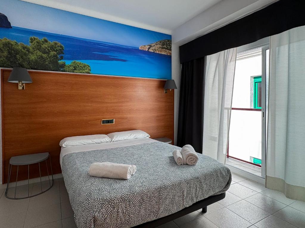 Postel nebo postele na pokoji v ubytování Hotel Maremagnum
