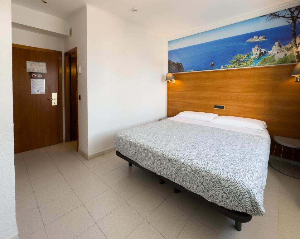 Postel nebo postele na pokoji v ubytování Hotel Maremagnum