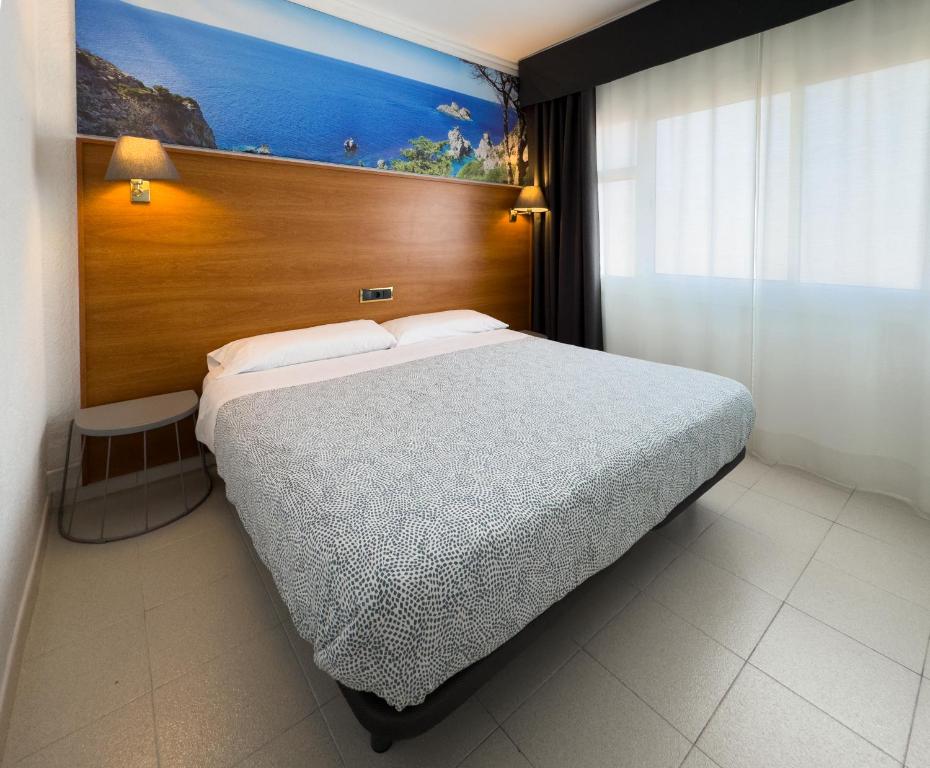 Postel nebo postele na pokoji v ubytování Hotel Maremagnum