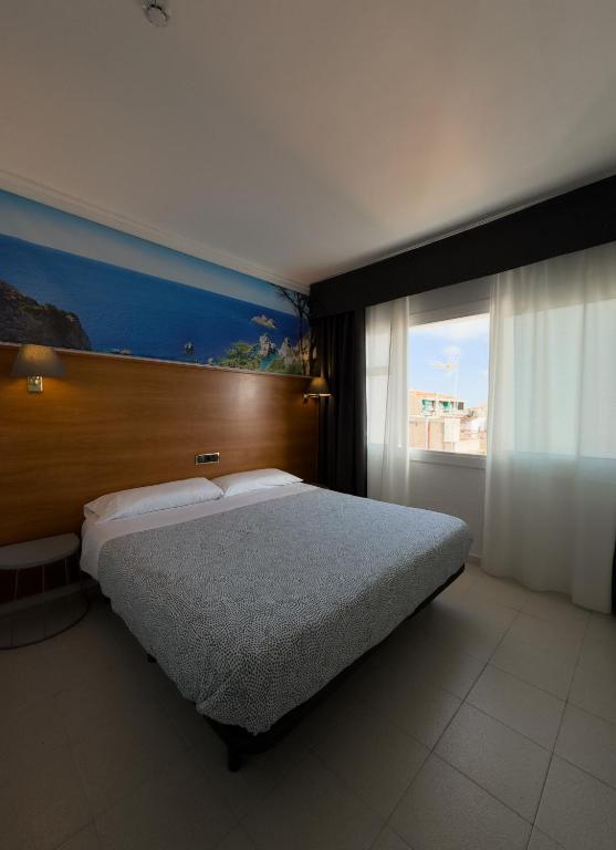 Postel nebo postele na pokoji v ubytování Hotel Maremagnum