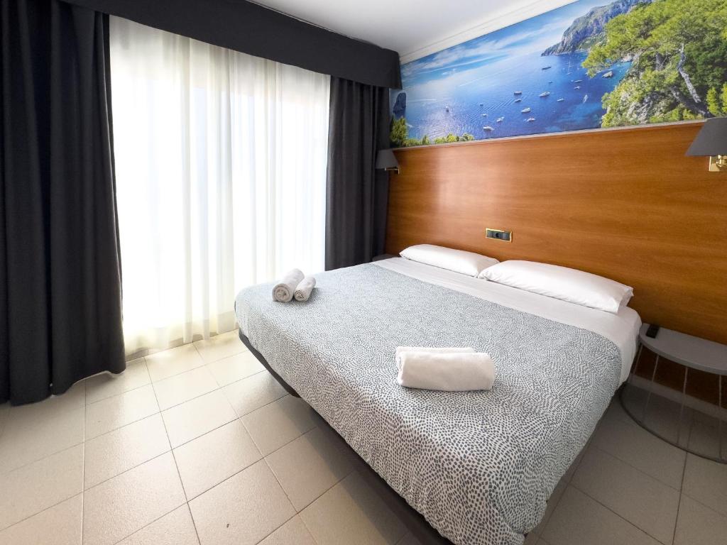 Postel nebo postele na pokoji v ubytování Hotel Maremagnum