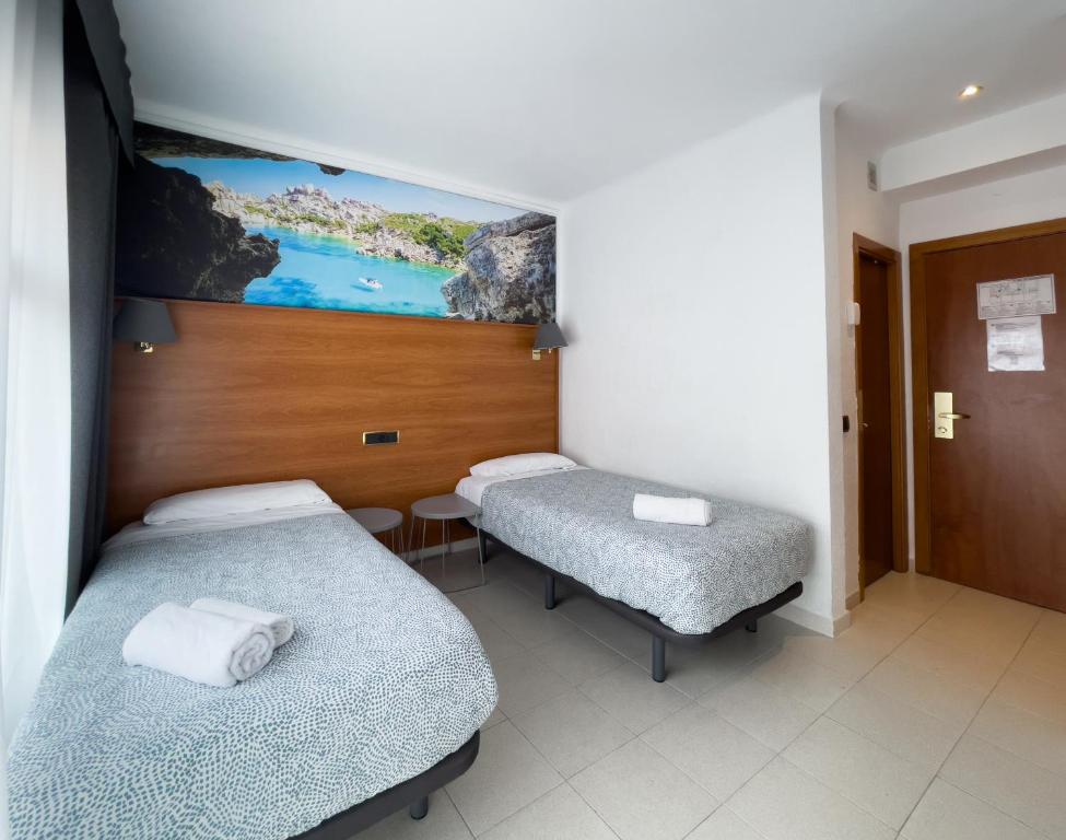 Postel nebo postele na pokoji v ubytování Hotel Maremagnum
