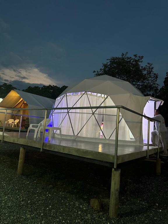 a tent is set up in front of tents at Eco Cabañas Montana - Glamping 2 