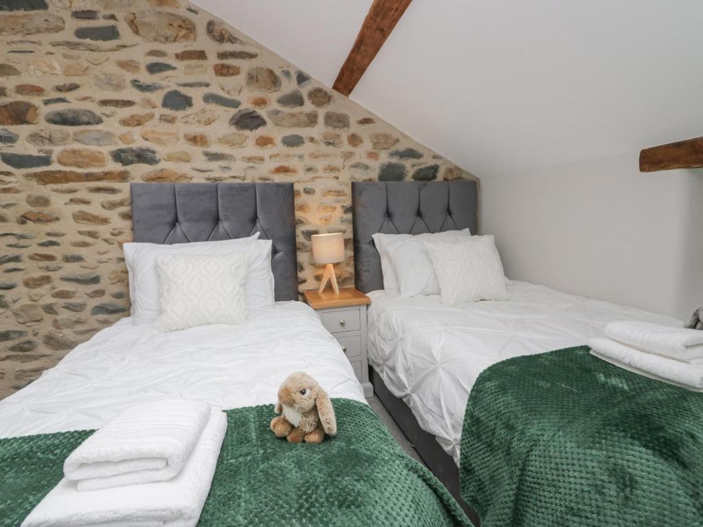 Postel nebo postele na pokoji v ubytování Howgill House