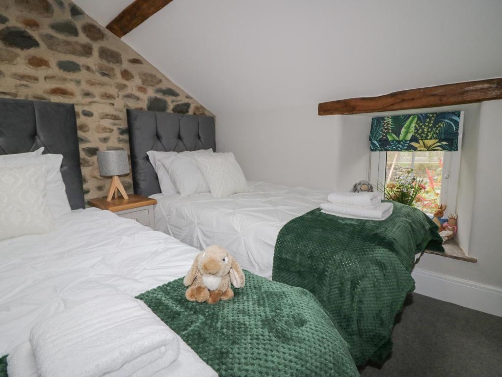 Postel nebo postele na pokoji v ubytování Howgill House
