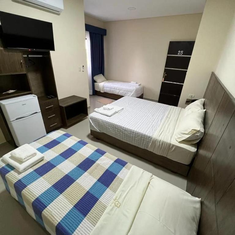 Postel nebo postele na pokoji v ubytování Hotel Villa