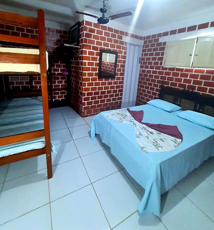 Postel nebo postele na pokoji v ubytování Casa de Temporada das Mangueiras