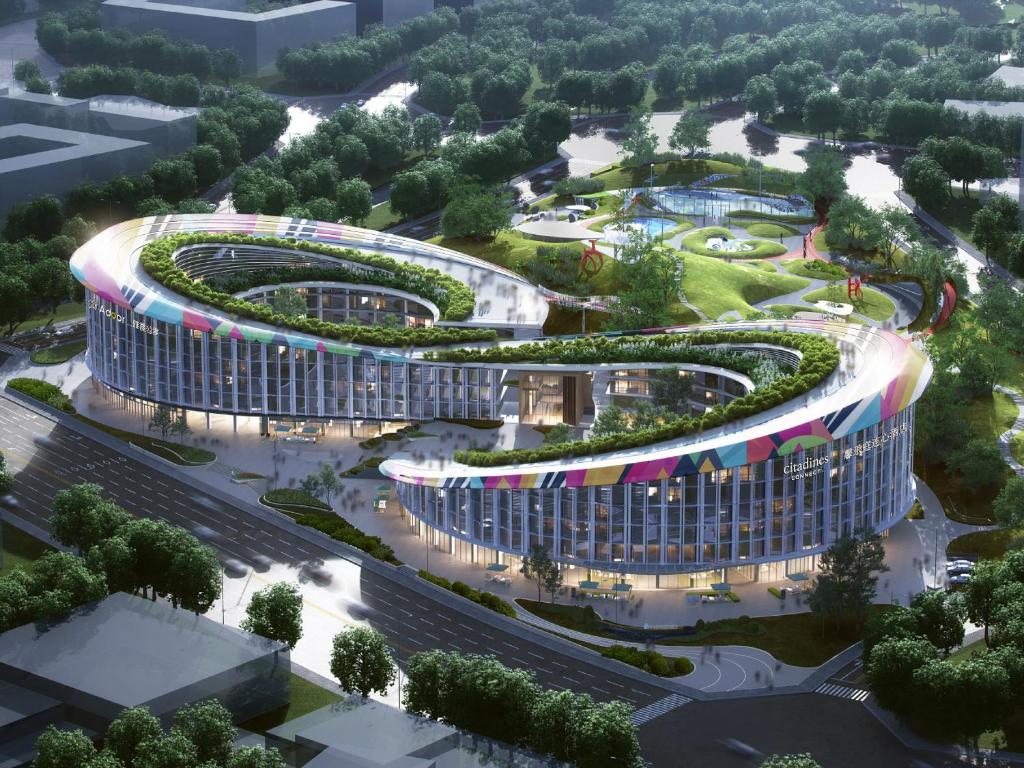 an aerial view of a building with a garden at Citadines Connect East Chengdu in Xinsanchaba