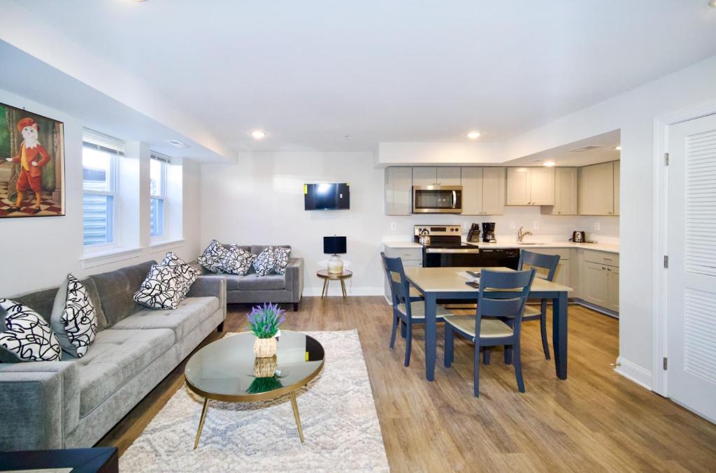 a living room with a couch and a table at The Lenny: Modern Boutique Loft in Washington